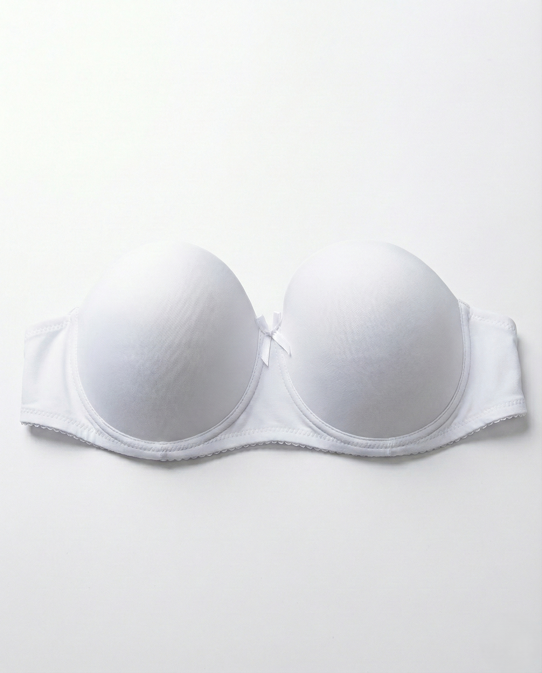 Black strapless push-up bra with seamless design and underwire support for bold lift and enhanced cleavage
