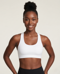 Athlete wearing Active Comfort Sports Bra with racerback design and breathable fabric during workout