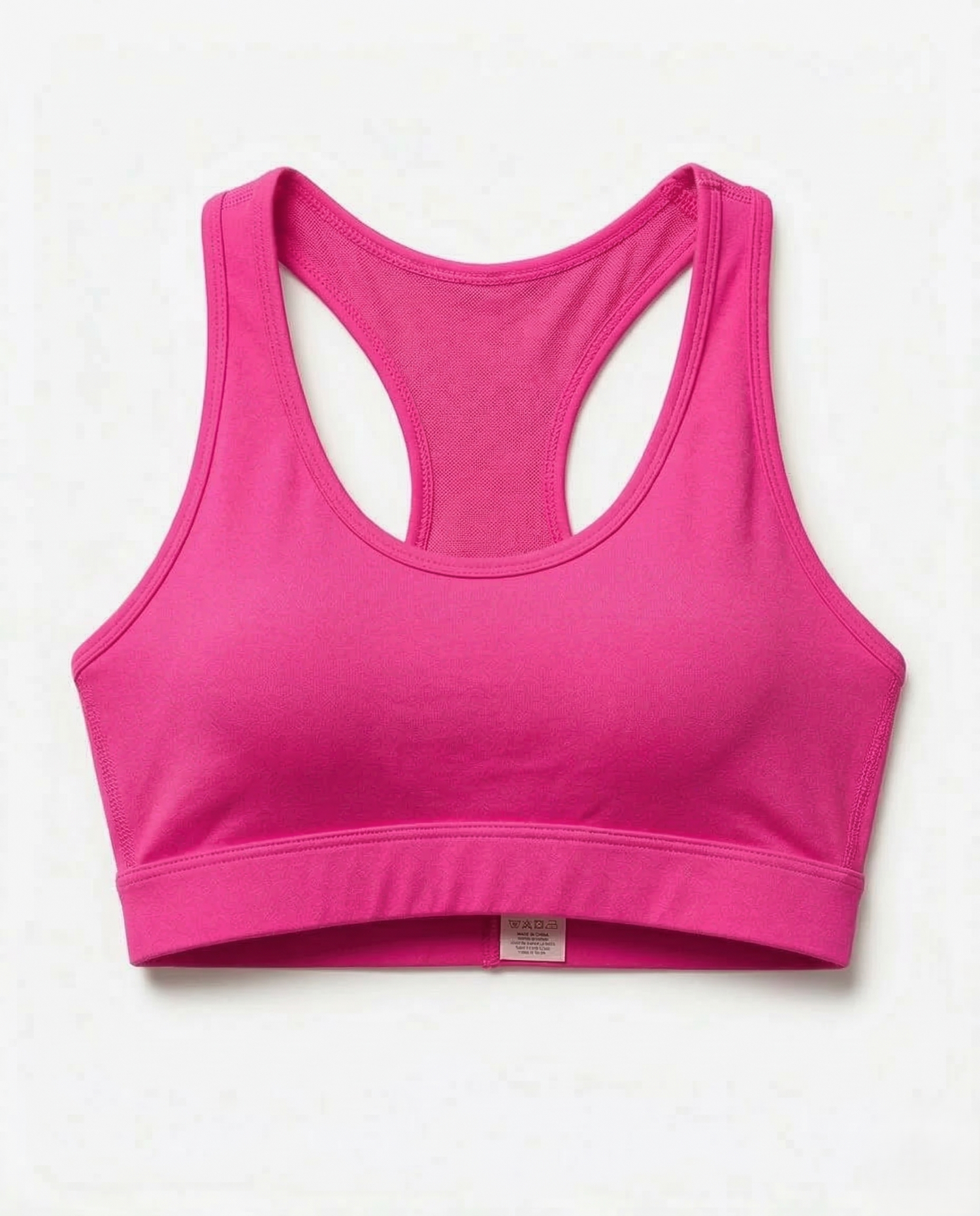 Woman wearing Active Comfort Sports Bra with racerback design and discreet back pocket during fitness activity