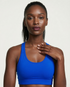 Active Comfort Sports Bra in black with racerback design and discreet back pocket for support and flexibility during workouts