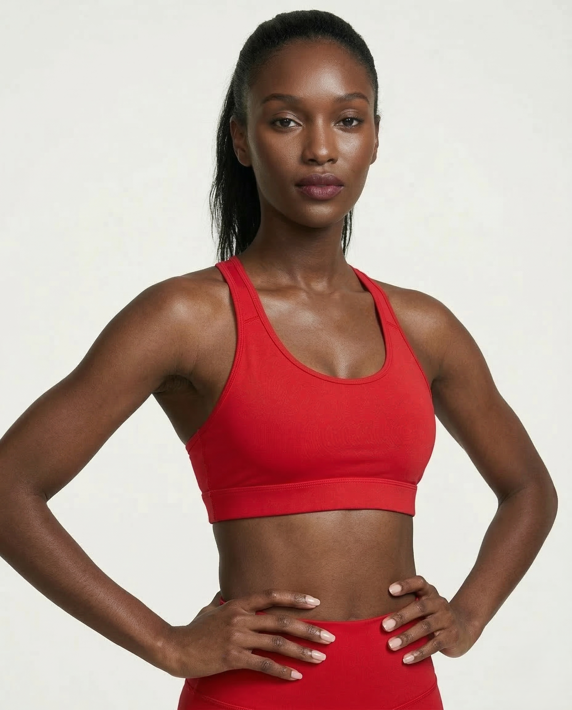 Athletic woman wearing black Active Comfort Sports Bra with racerback and smooth stretch fabric during workout