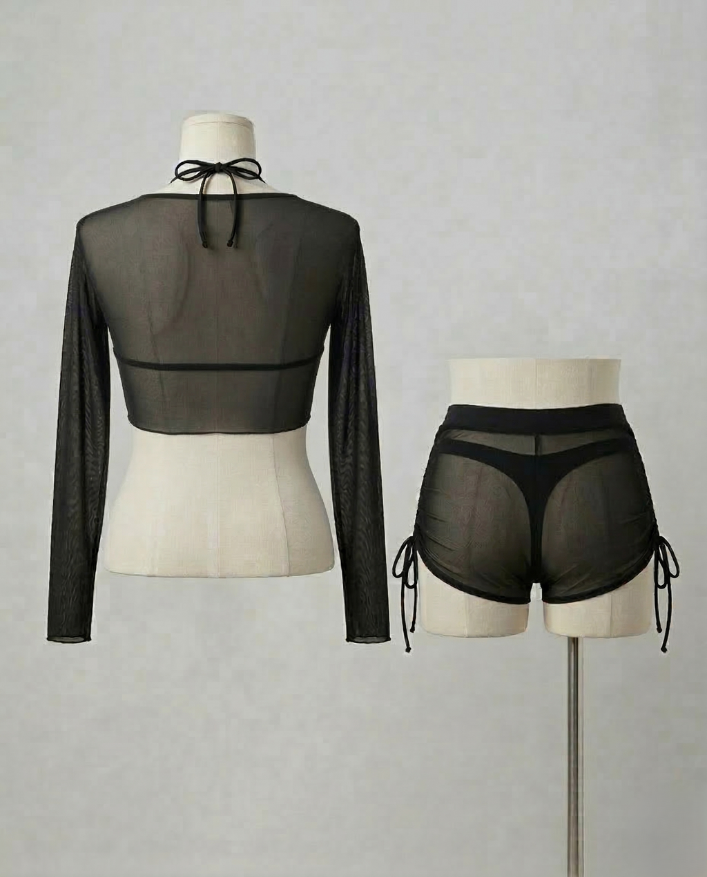 Black Mesh 4-Piece Bikini with sheer mesh layers and long-sleeve cover in a bold, elegant design