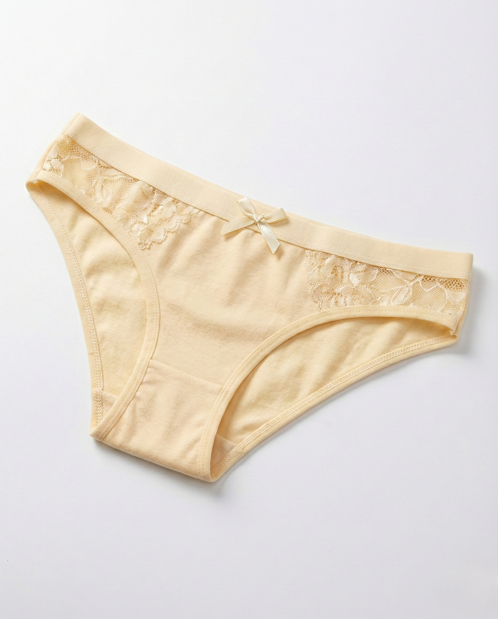 Low-rise cotton sexy panties with lace trim and bow, high-cut leg silhouette for natural comfort and confident curves