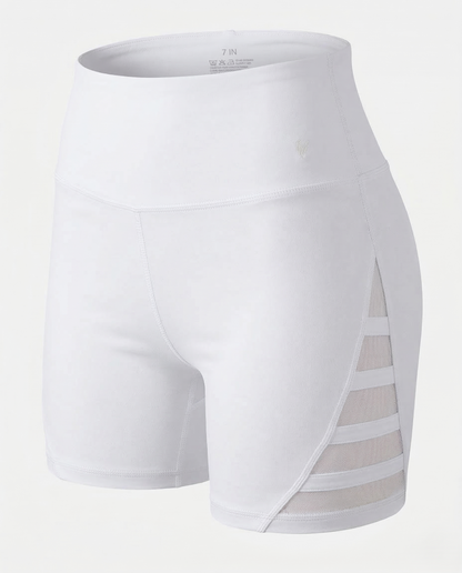 Peach-colored curve-enhancing yoga pants with mid-rise waistband and contouring fit for lifting and shaping curves