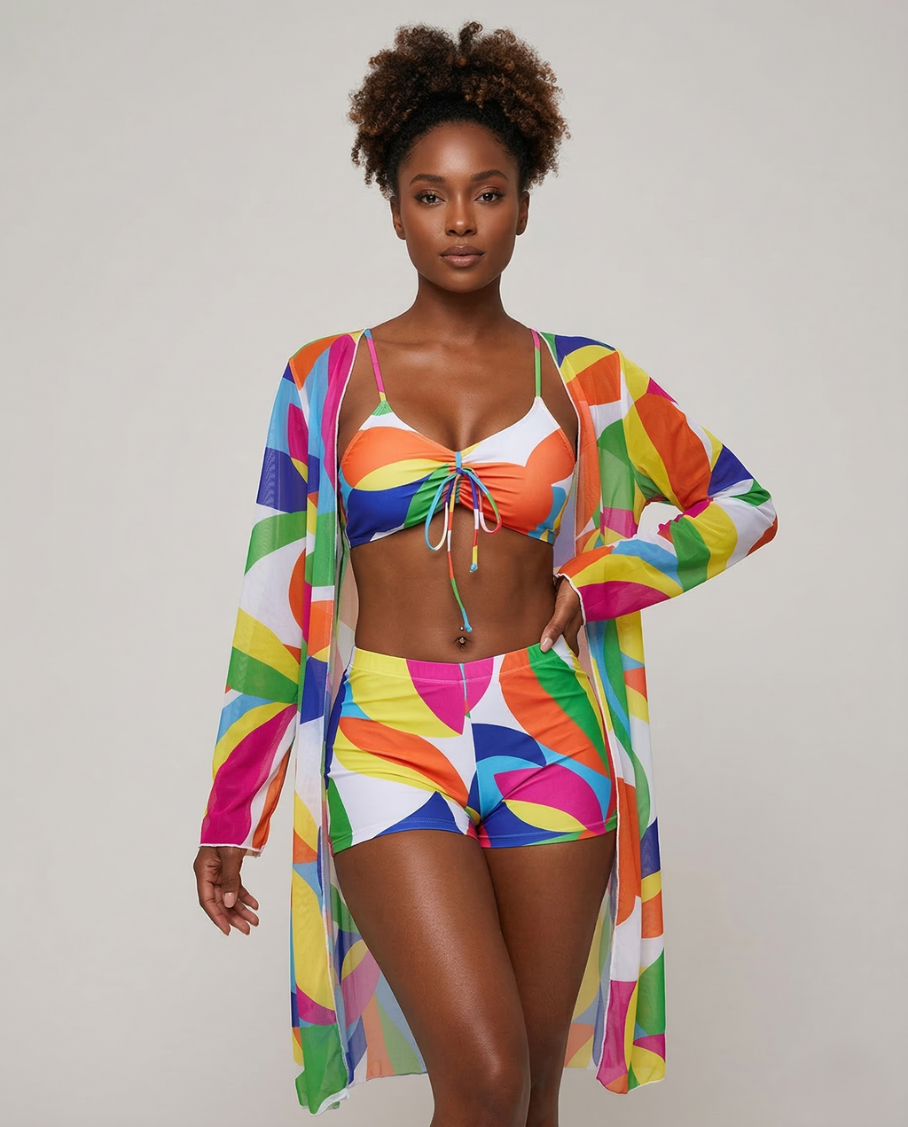 Floral three-piece swimsuit with crop top and high-waisted bottoms featuring vibrant floral print and sculpted shape