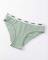 Mid-waist cotton panties in soft breathable fabric with seamless design and flat elastic waistband for daily comfort