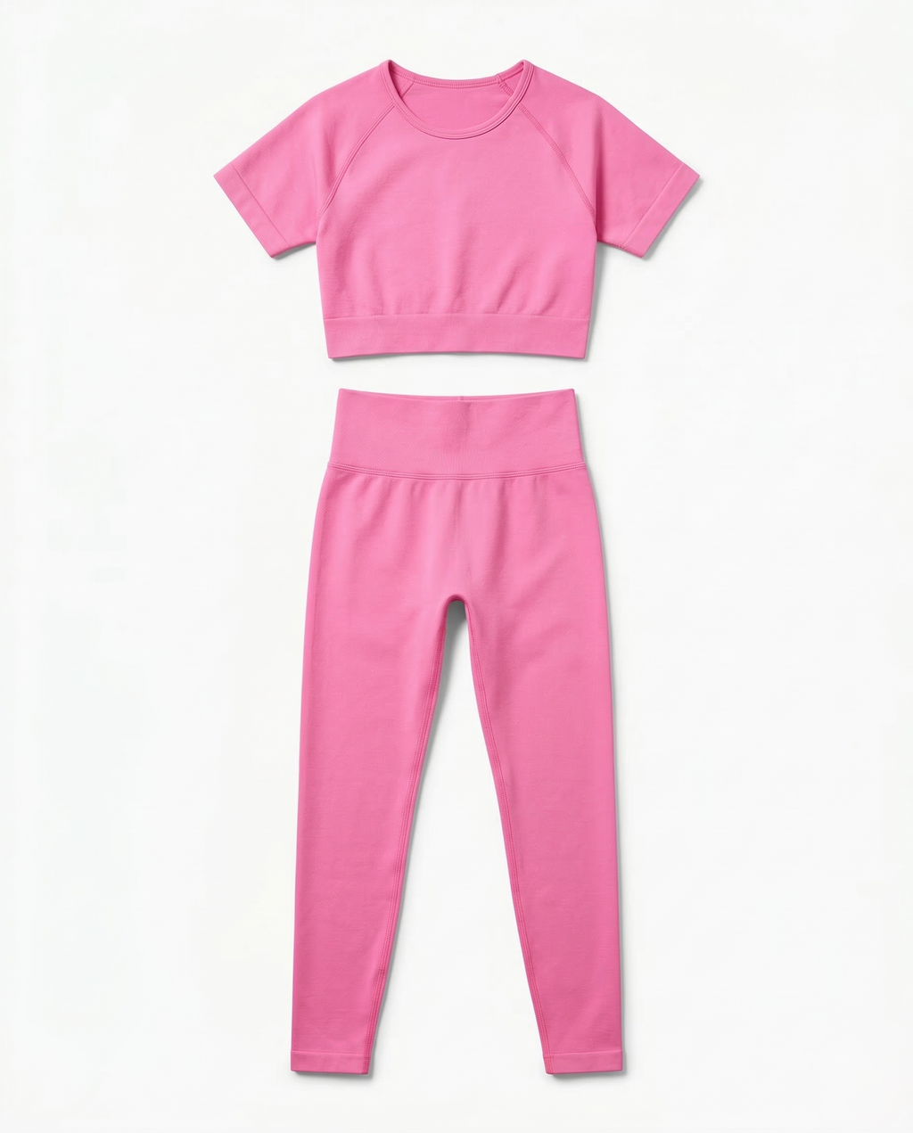 Women wearing sleek seamless fitness set with short sleeve top and stretch pants in vibrant color
