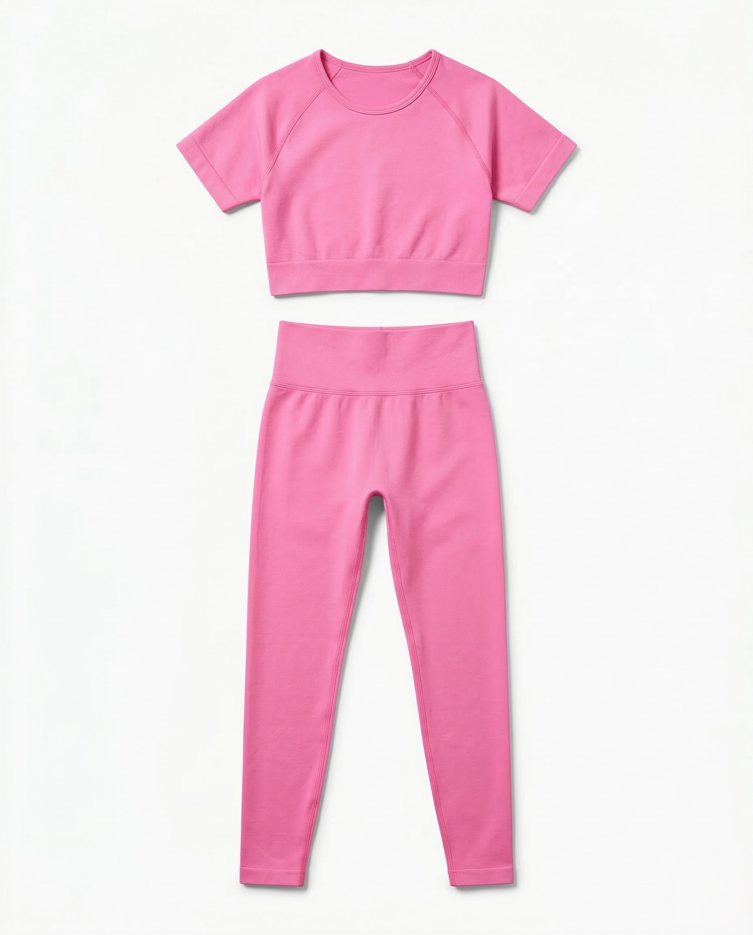 Women wearing sleek seamless fitness set with short sleeve top and stretch pants in vibrant color