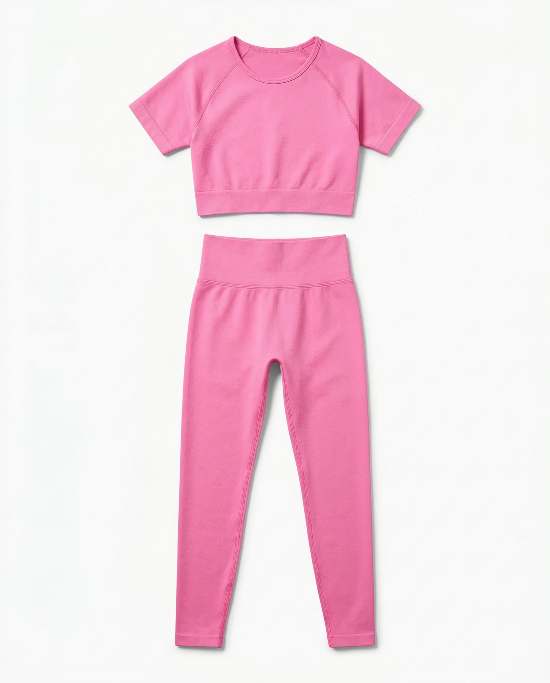Women wearing sleek seamless fitness set with short sleeve top and stretch pants in vibrant color