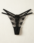 Sheer lace embroidered thong with delicate mesh and animal-inspired embroidery enhancing natural curves