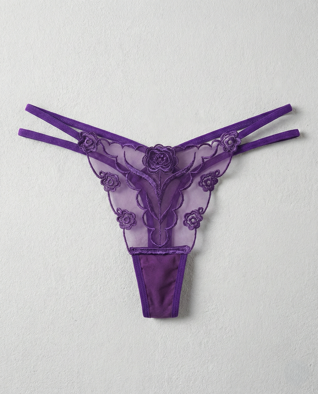 Sheer lace embroidered thong with animal-inspired lace detail and seamless design for perfect curves