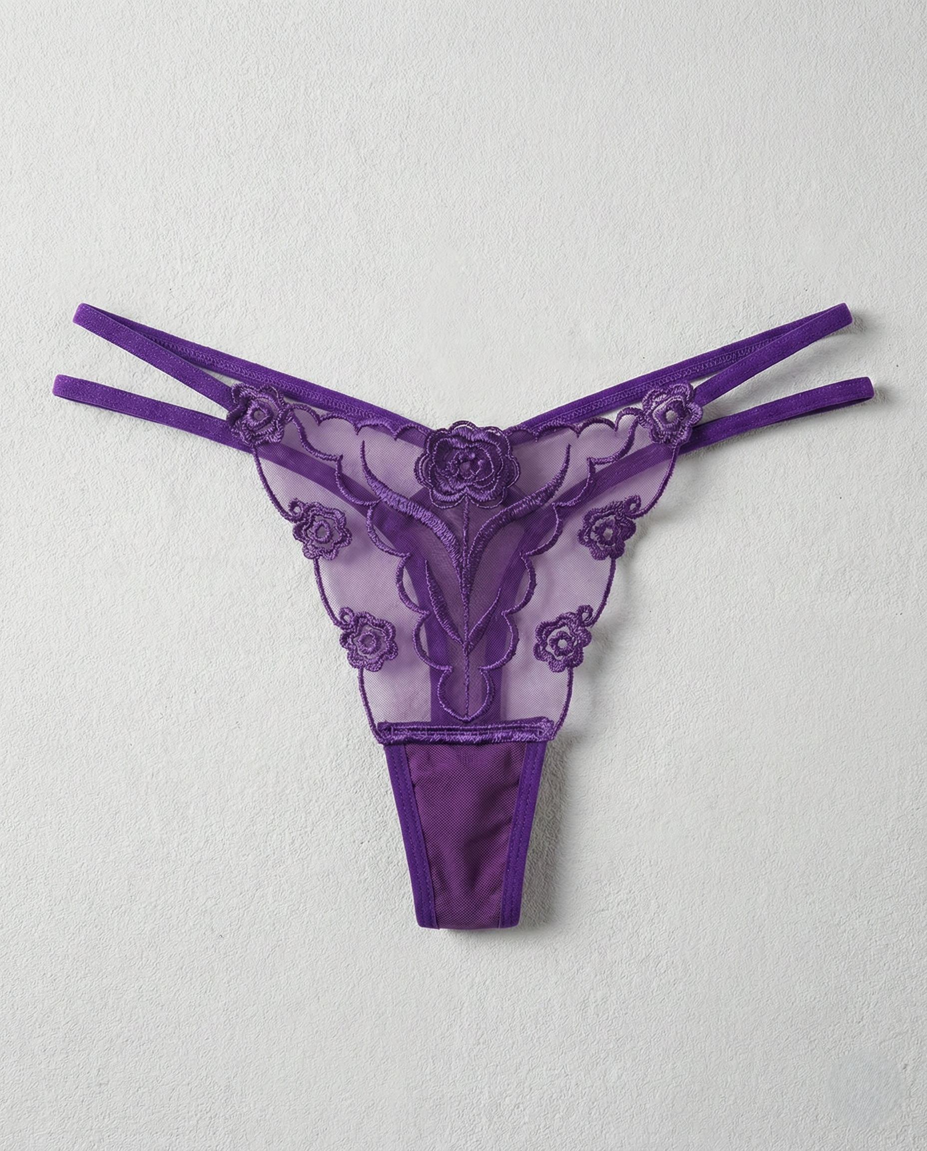 Sheer lace embroidered thong with animal-inspired lace detail and seamless design for perfect curves