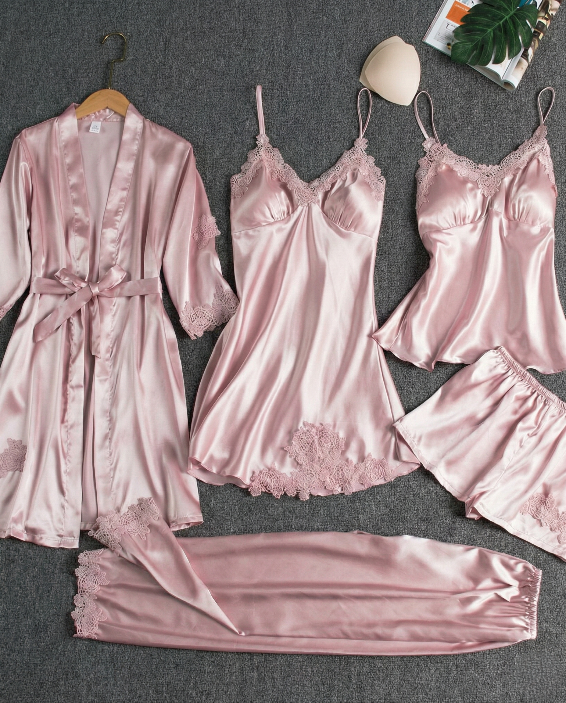 Woman wearing a soft Silk-Touch Halter Pajama Set with adjustable halter neckline and matching bottoms for comfortable home lounging