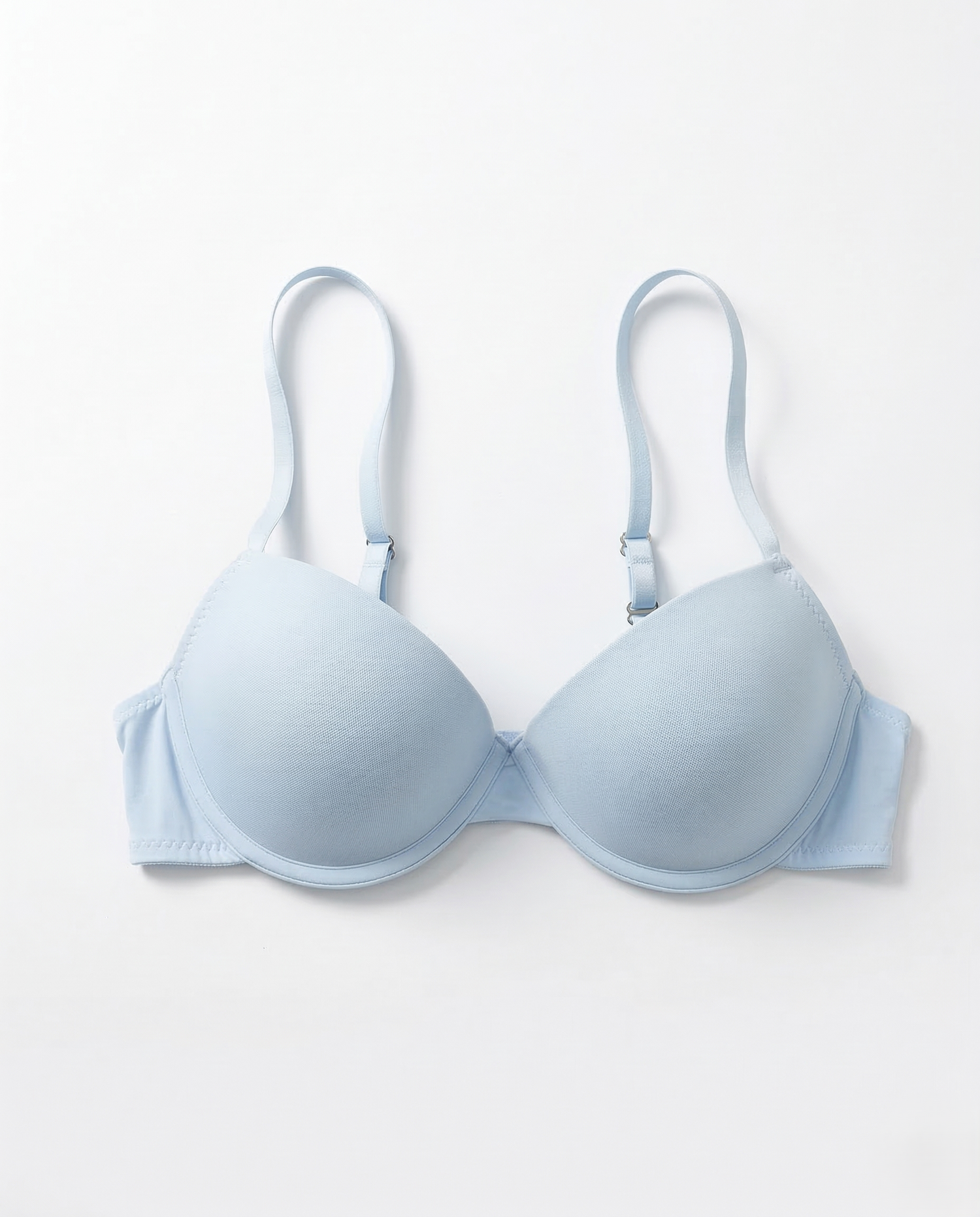 Smooth underwire bra with seamless cups, lightweight support, and adjustable straps enhancing natural feminine curves