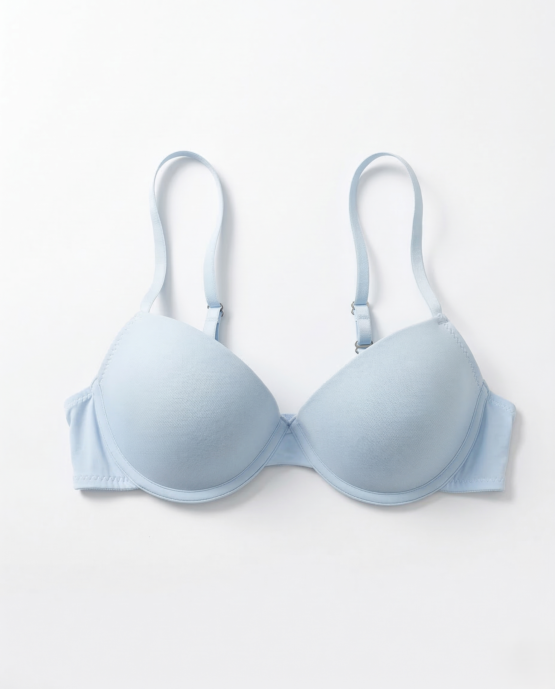 Smooth underwire bra with seamless cups, lightweight support, and adjustable straps enhancing natural feminine curves