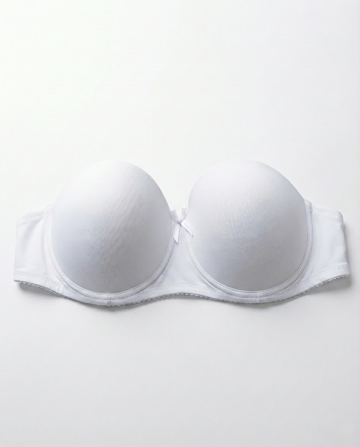 Black strapless push-up bra with seamless design and underwire support for bold lift and enhanced cleavage